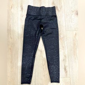 Terez M shiny black snake skin leggings.
